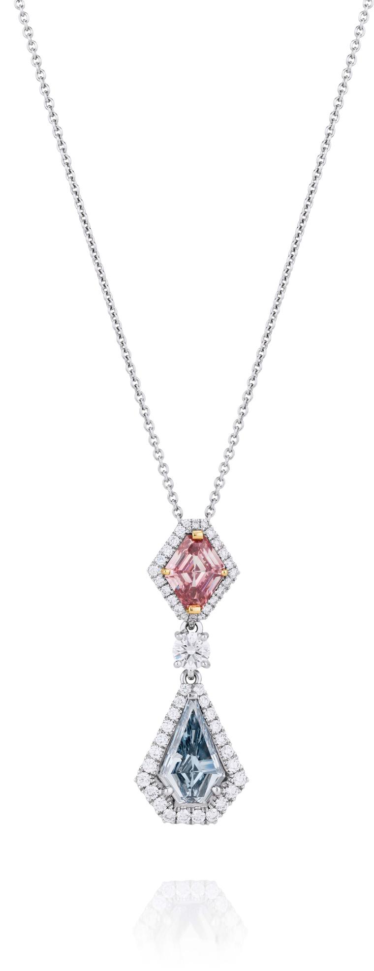 De Beers 1888 Master Diamonds Aura pendant, set with a shield-cut Fancy Intense pink diamond, round brilliant diamonds and a shield-cut Fancy Intense blue diamond.