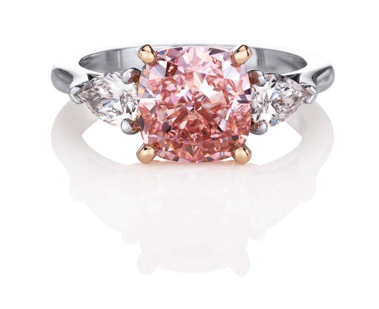 De Beers 1888 Master Diamonds ring, set with a 4.42ct cushion-cut Fancy Intense pink diamond flanked by two pear-cut diamonds.