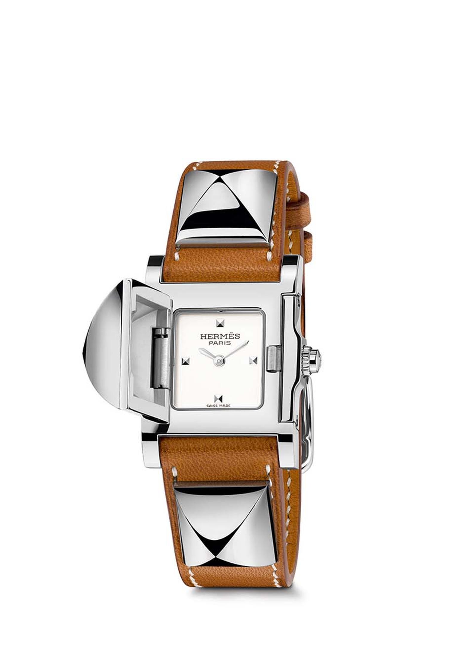 Pictured with a natural Barenia calfskin strap, the Hermès Médor watch was launched in 1993 when the leather strap with its “Clous de Paris” pyramid-shaped studs caught the eye of a designer at Hermès and was transformed into a secret watch.