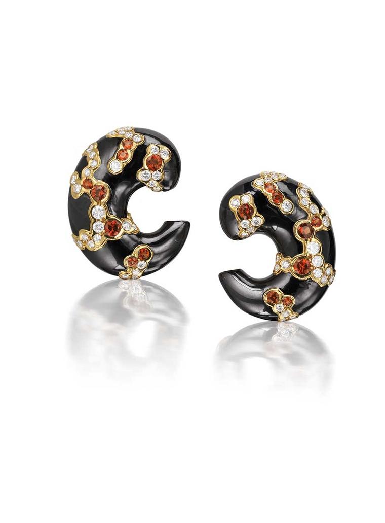 Matching Marina B orange sapphire and diamond cuff earrings.