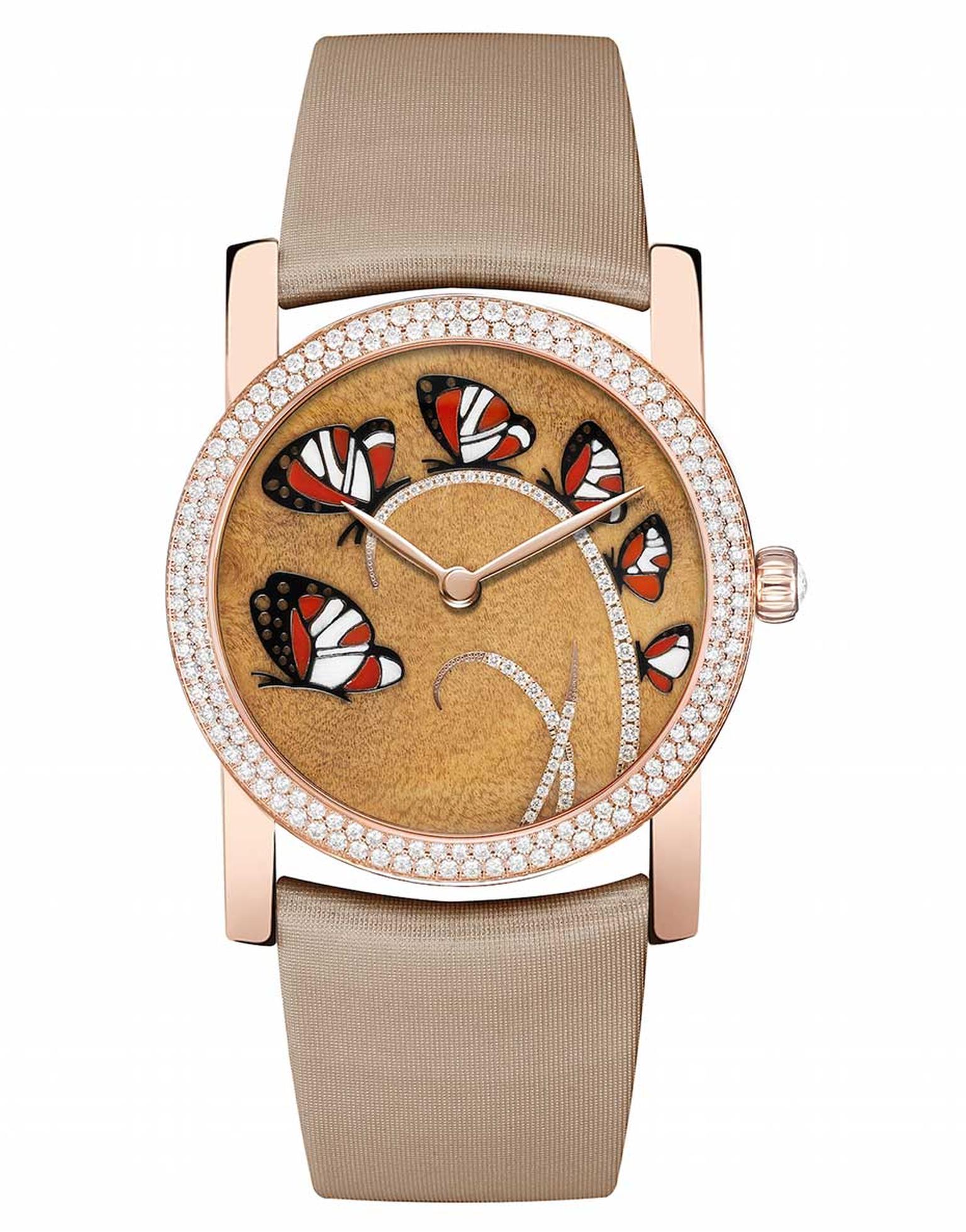 Chaumet Attrape-moi...si tu m'aimes (Catch me...if you love me) watch in pink gold, with a dial decorated with six butterflies set against a precious myrtle burl wood background. The butterfly wings are made from inlaid red carnelian, white wood and black