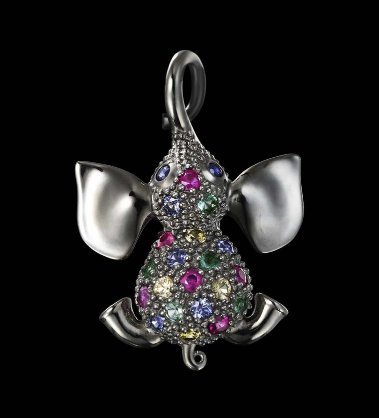 Dashi Namdakov Sapphire Elephant pendant in white gold and black rhodium, pictured from above, with a saddle of diamonds, sapphires, rubies and emeralds between smooth flappy ears.