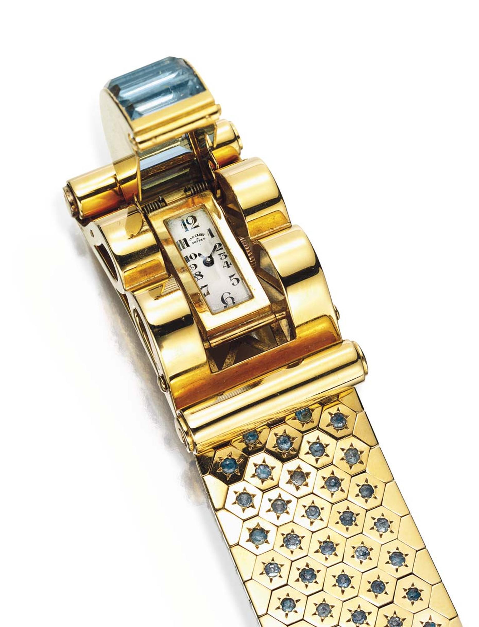 The Van Cleef & Arpels Ludo Hexagone bracelet watch features a watch dial hidden behind a swathe of aquamarines.