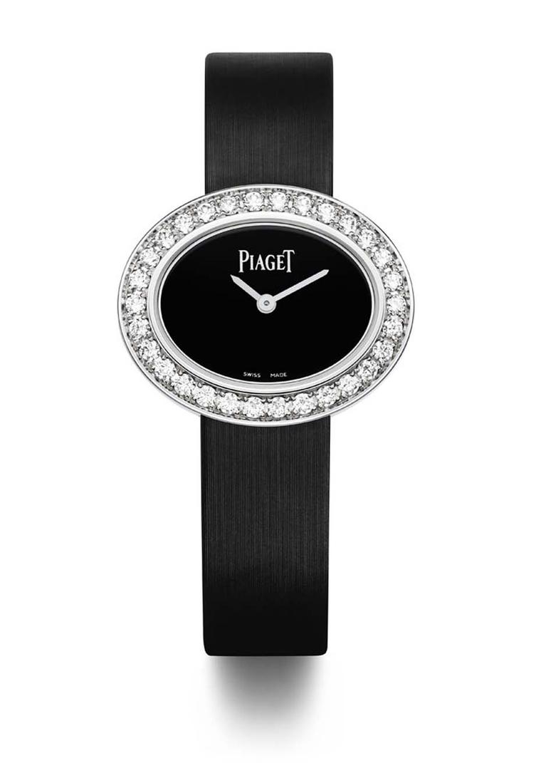 Piaget Limelight Diamonds watch in white gold with an oval-shaped case and black lacquer dial, set with 1.00ct diamonds on the bezel and presented on a black satin strap with an ardillon buckle set with a single diamond.