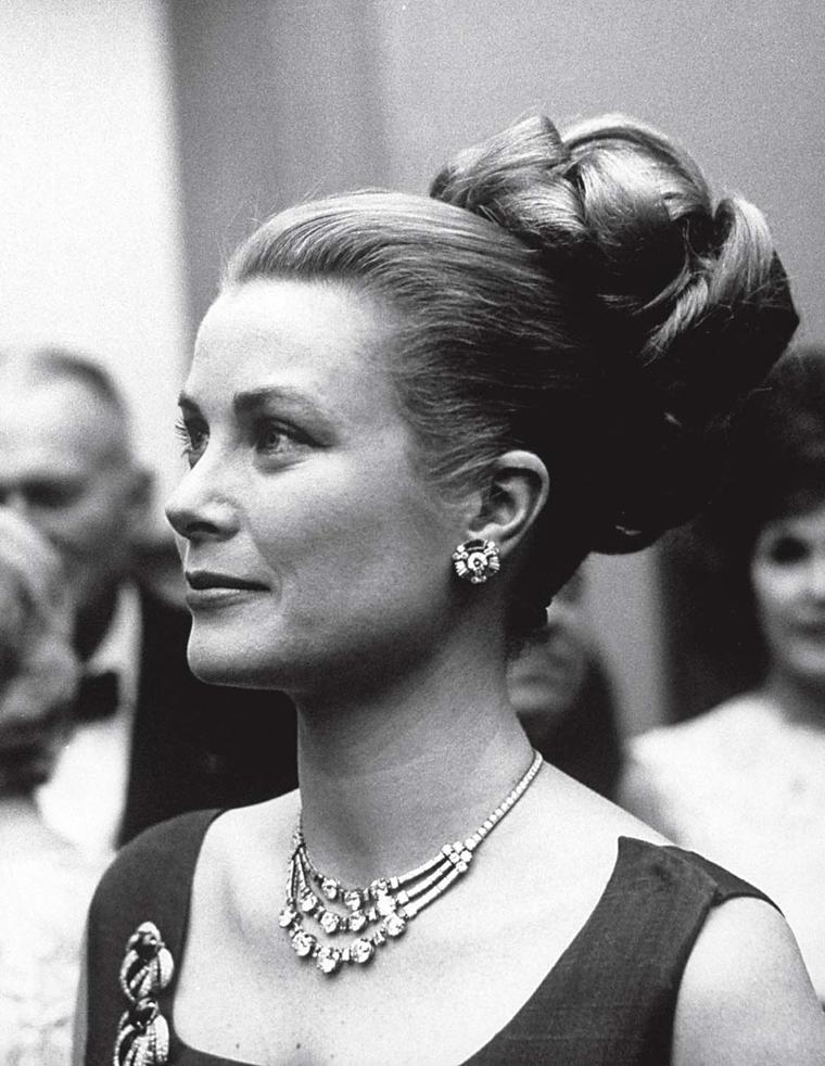 Princess Grace Kelly wearing a Cartier diamond necklace to a reception in Philadelphia, which was given to her on her wedding day in 1956.