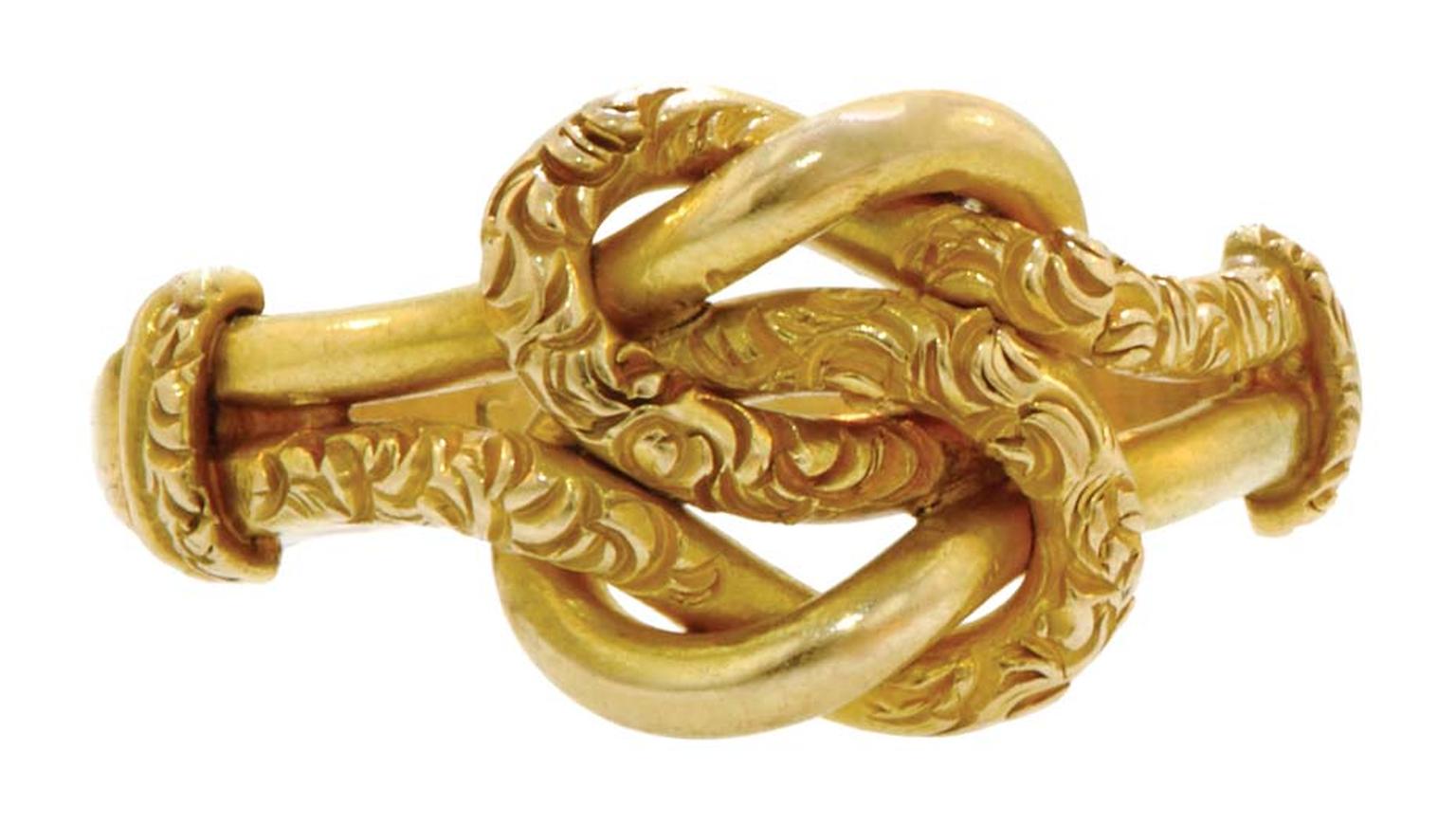 Double Lovers' Knot ring in gold featuring a pair of intertwined knots, one plain, one chased, circa 1860.