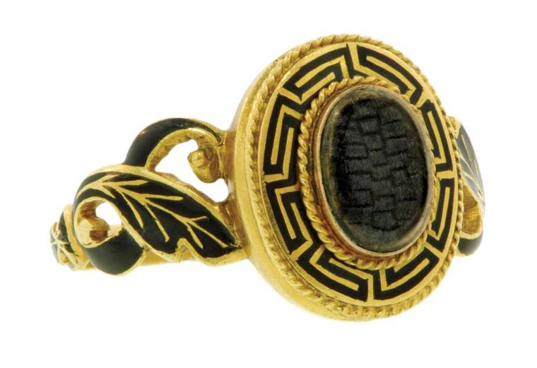 Mourning ring featuring gold, black enamel and hair, circa 1850.