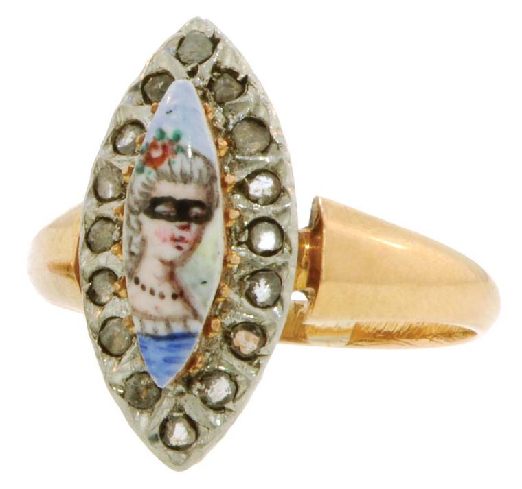 20th-century diamond Portrait and Mask ring featuring a hand-painted masked woman framed by rose-cut diamonds. From the private collection of Danielle Miele.