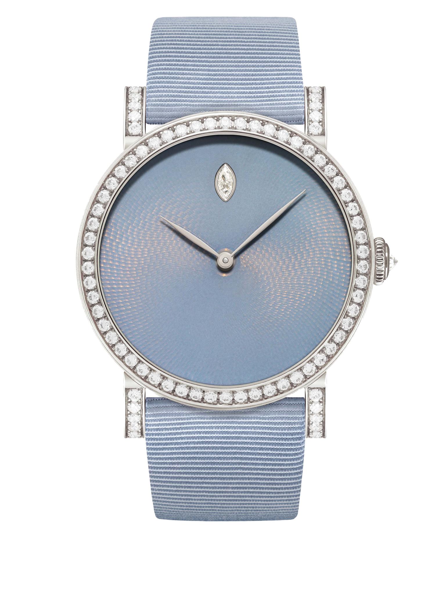The DeLaneau Rondo Translucent Hoar Frost watch has a 36mm white gold case set alight with 272 diamonds encircling the bezel and lugs. The mysterious greyish-blue enamel dial is punctuated by a single diamond drop marking the hour at 12 o'clock.