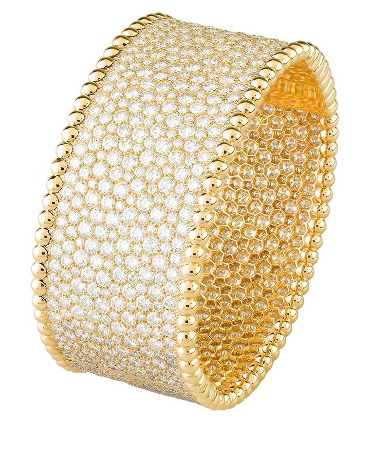 Van Cleef & Arpels Perlée snow-set diamond cuff bracelet showcases the maison’s extraordinary craftsmanship by using a technique that makes the jewel appear to have literally been dusted in diamond snowflakes.
