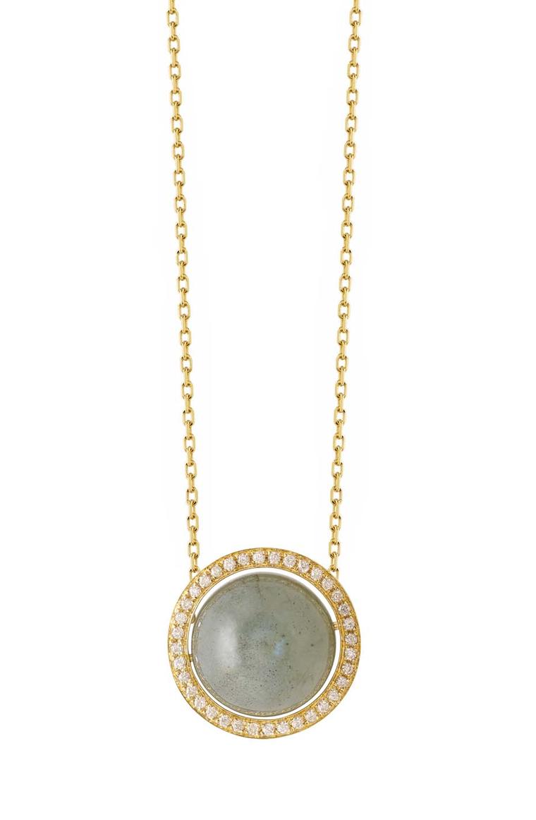 Noor Fares Aurora pendant with a centre labradorite set in a yellow gold rotating axis with white diamonds.
