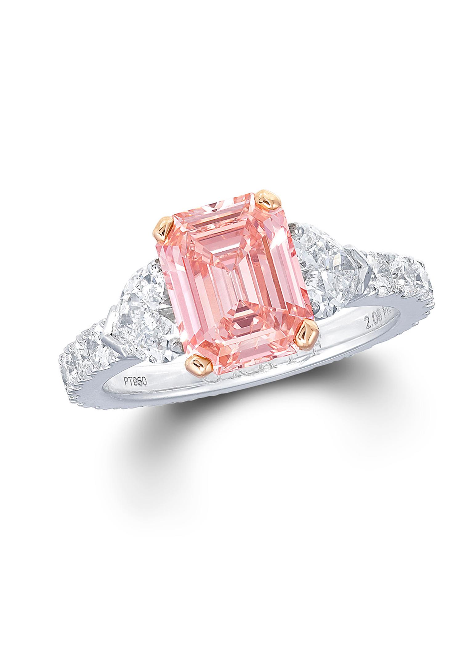 Graff emerald-cut pink diamond engagement ring with a diamond band.