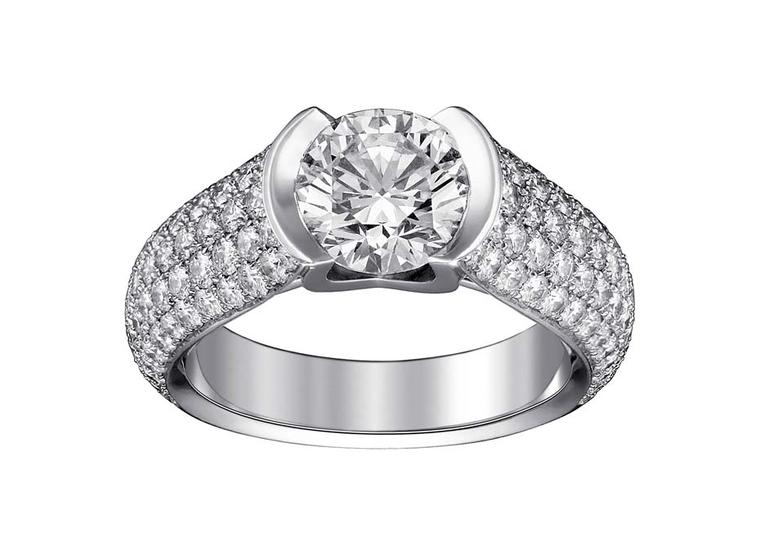 C de Cartier solitaire diamond engagement ring plays with the brand’s initial, which is ingeniously adapted as a setting for the brilliant-cut diamond in the centre, accompanied by smaller brilliant-cut diamonds set on the platinum ring.