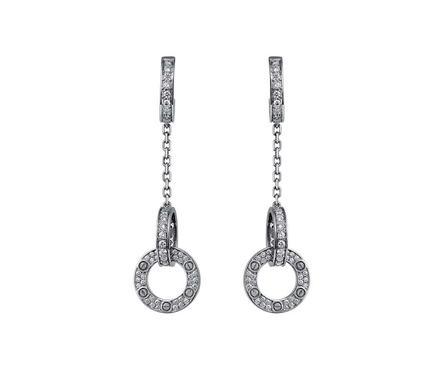 Resembling miniature handcuffs covered in diamonds, the Love drop earrings in platinum and diamonds are a strong statement about your feelings towards your loved one.