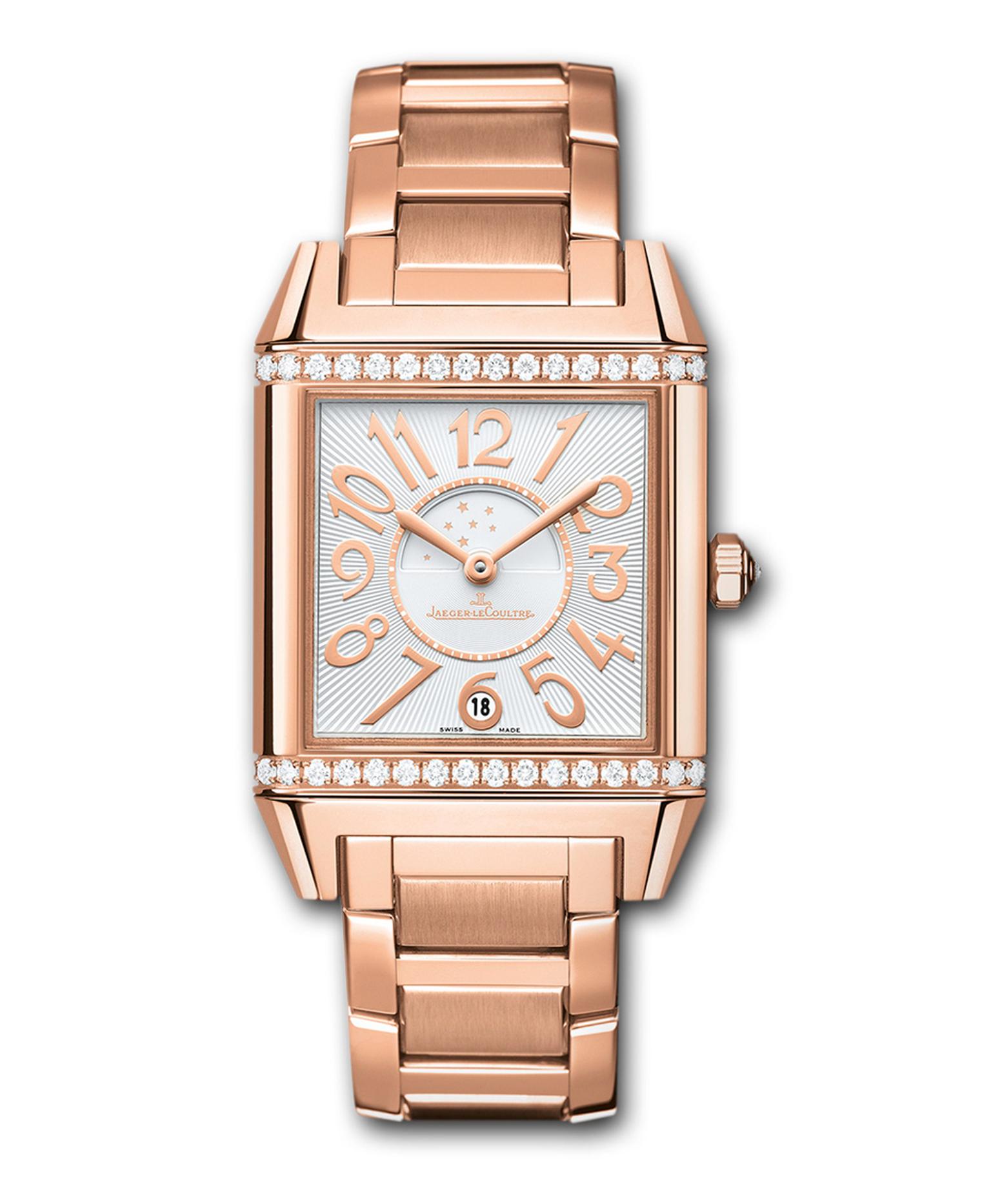 The Jaeger-LeCoultre Reverso Squadra Lady Duetto watch is just that: a square rendition of the classic rectangular Reverso. The front dial of the pink gold model features a diamond-set bezel, a silver guillochéd dial, golden numerals and a date display an