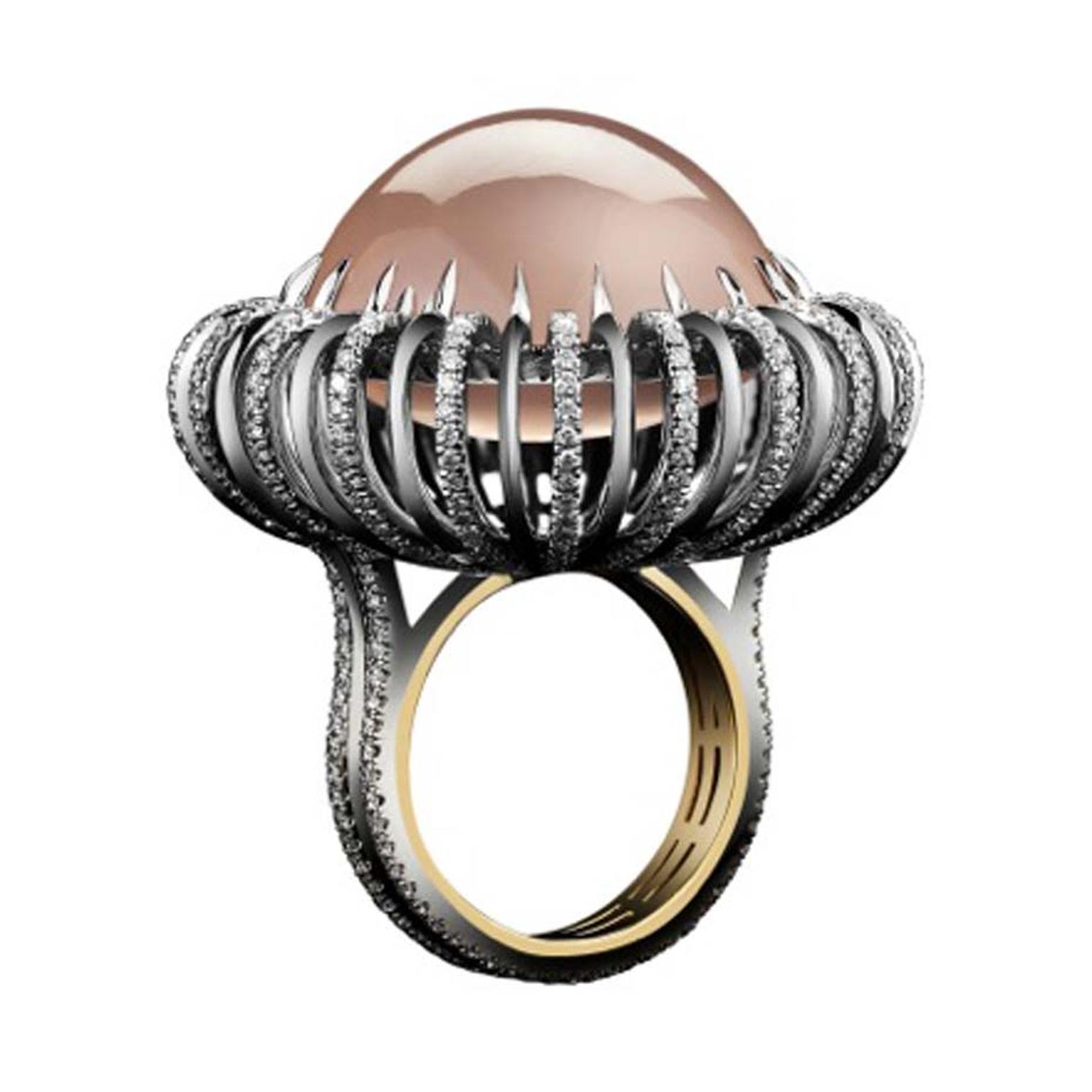 Alexandra Mor rose quartz cabochon orb ring surrounded by a melee of diamonds which create a powerful contrast to the pale quartz centre.