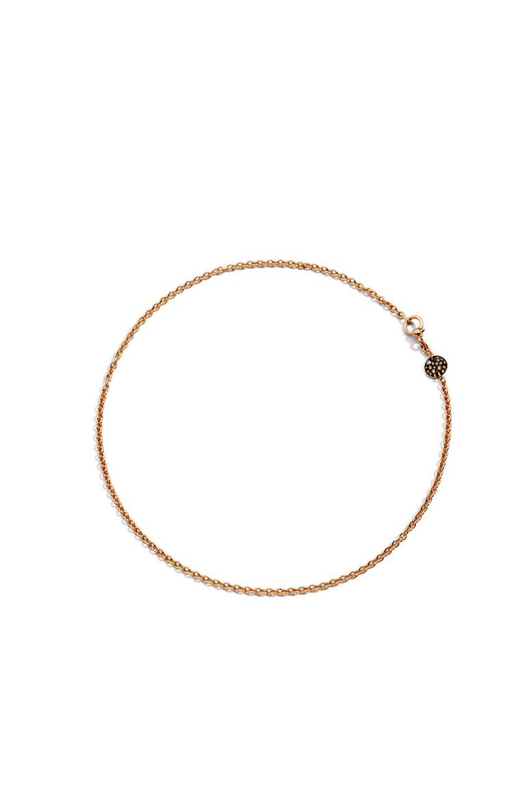 Pomellato Sabbia choker necklace featuring a rose gold disc set with brown diamonds.