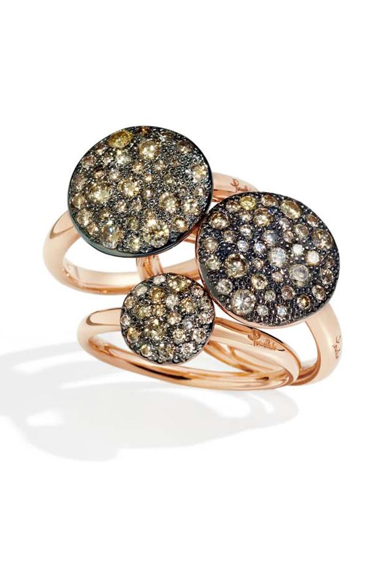 Pomellato Sabbia rings in rose gold, set with white, black or brown diamonds in a random pattern that mimics the sun on sand.
