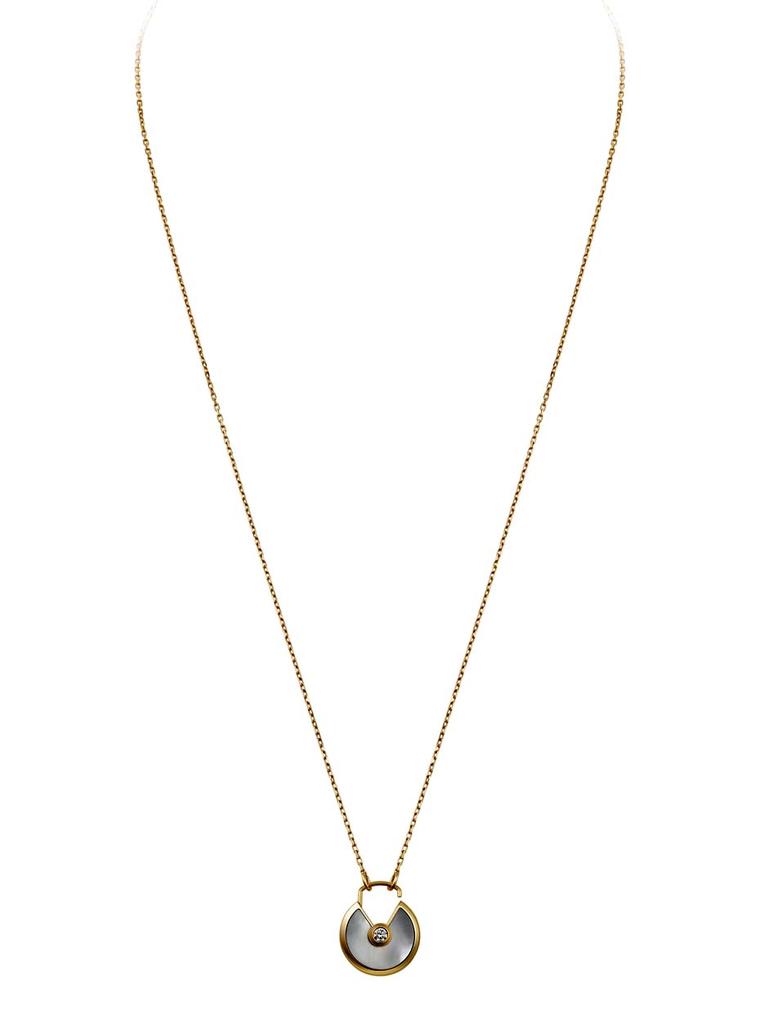 Cartier Amulette de Cartier necklace in yellow gold with white mother-of-pearl and a brilliant-cut diamond (£2,980).