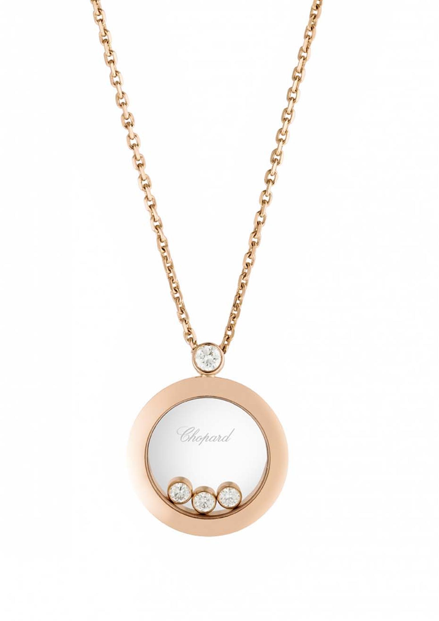 Chopard Happy Diamonds pendant in rose gold featuring three mobile diamonds in a circular disc suspended from a chain with one static diamond (£2,570).