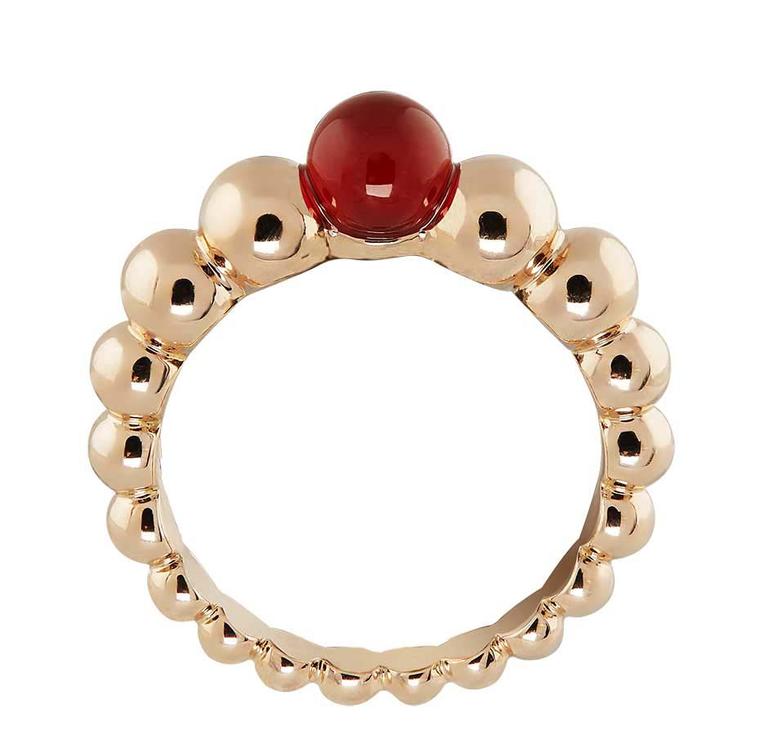 Van Cleef & Arpels Perlée Couleurs rose gold ring, set with a vivid red cornelian gemstone at the crown (£1,550).