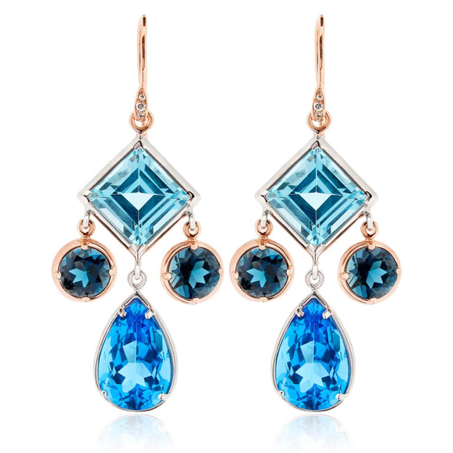 Dinny Hall Amelie Anniversary earrings featuring Ostro, London and Swiss blue topaz with sterling silver and rose gold. The mini chandelier earrings, with the three blue hues and three different gemstone cuts, showcase Dinny Hall's signature bohemian styl