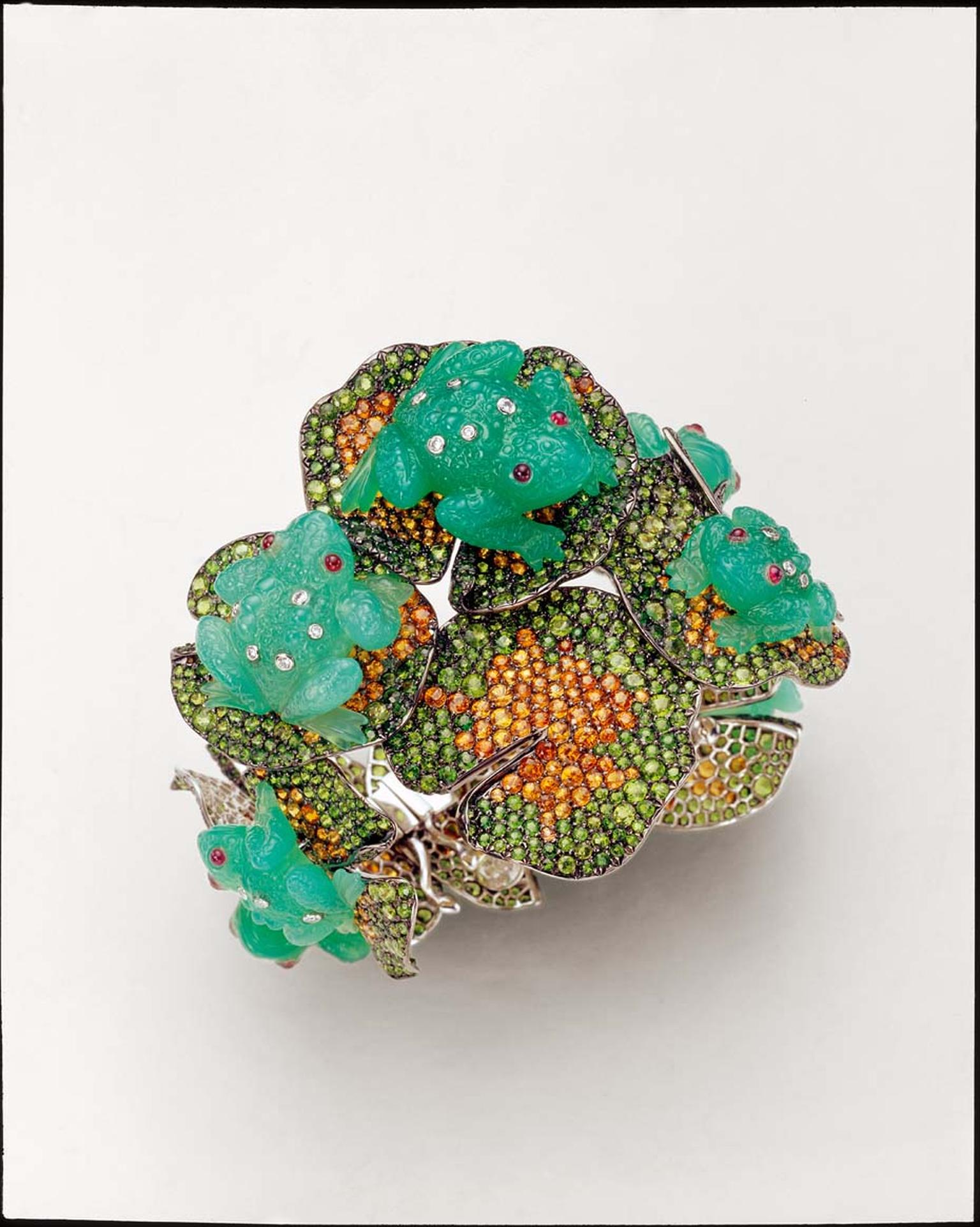 Suzanne Syz Prince Charming bangle set in white gold featuring four chyrosprase frogs, 48.88ct of tsavorites, 46.08ct of garnets, diamonds and cabochon rubies.
