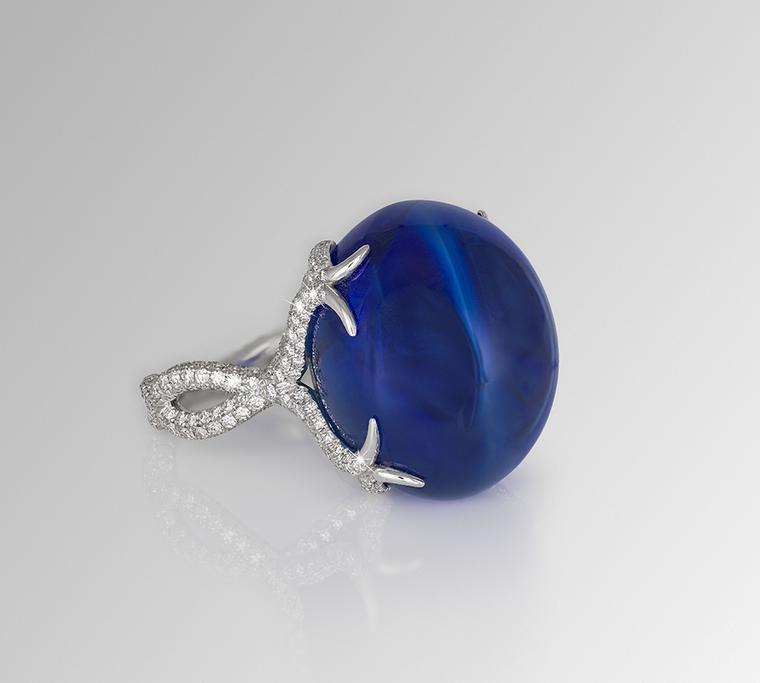 One-of-a-kind David Morris ring, set with a 64.55ct sapphire double cabochon and diamonds.