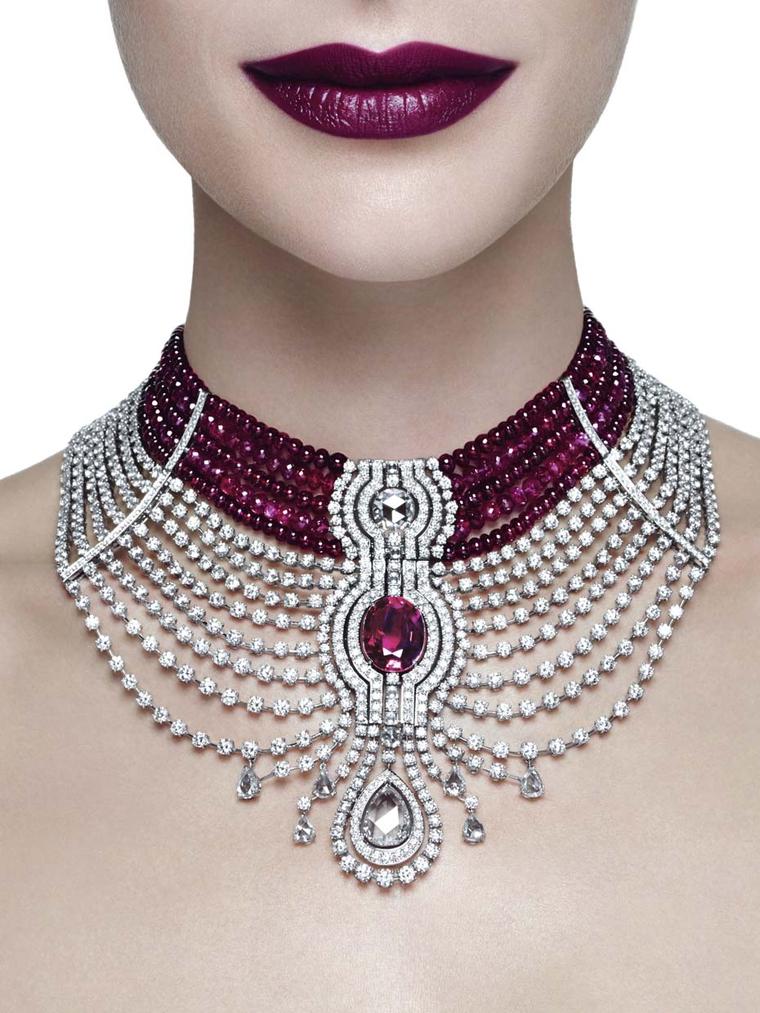 The star of Cartier's Reine Makéda ruby necklace, part of the Royal collection created for the Biennale des Antiquaires 2014, is a 15.00ct oval-shaped Mozambique ruby, with ruby beads and diamonds completing the elaborate choker-style necklace.