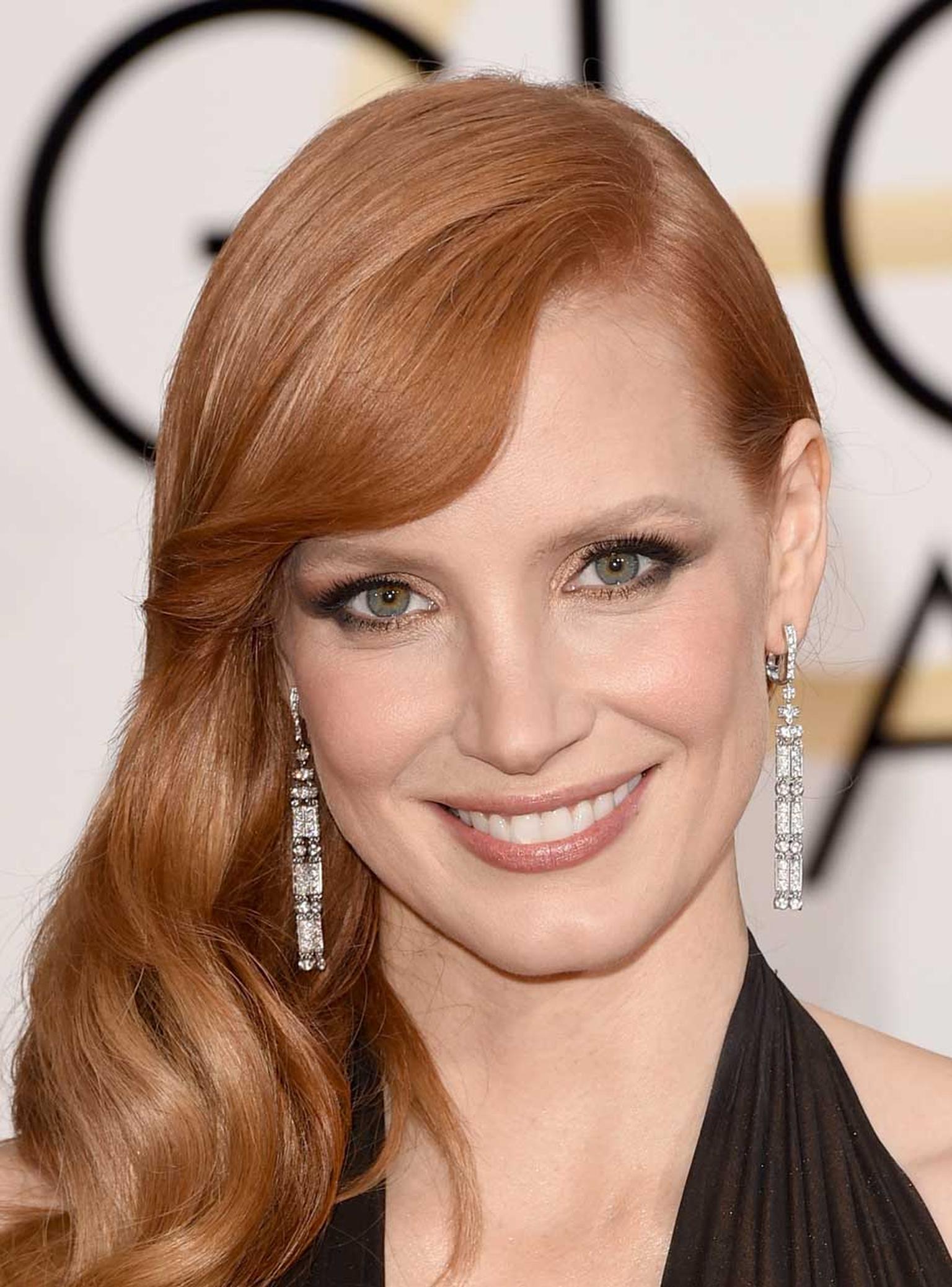 The Piaget Limelight Couture Précieuse Earrings in white gold with diamonds worn at the 2015 Golden Globes by American actress Jessica Chastain.