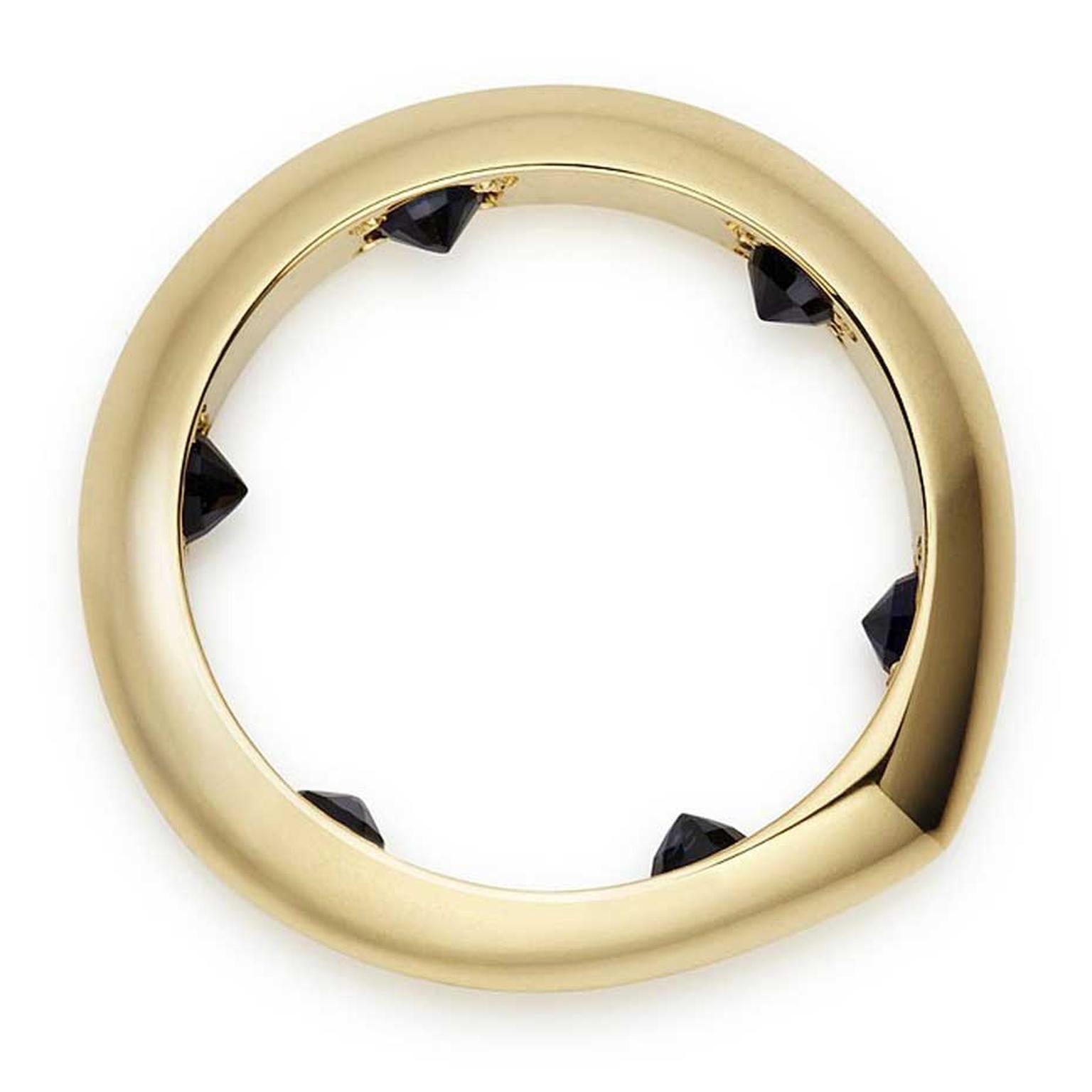 Hannah Martin's Secret Stud ring in 18ct yellow gold with rubies, finished with black rhodium.