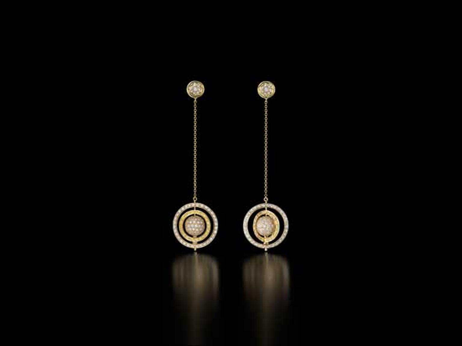The Spinning Orb earrings in gold with yellow and white pavé diamonds from Liv Ballard.