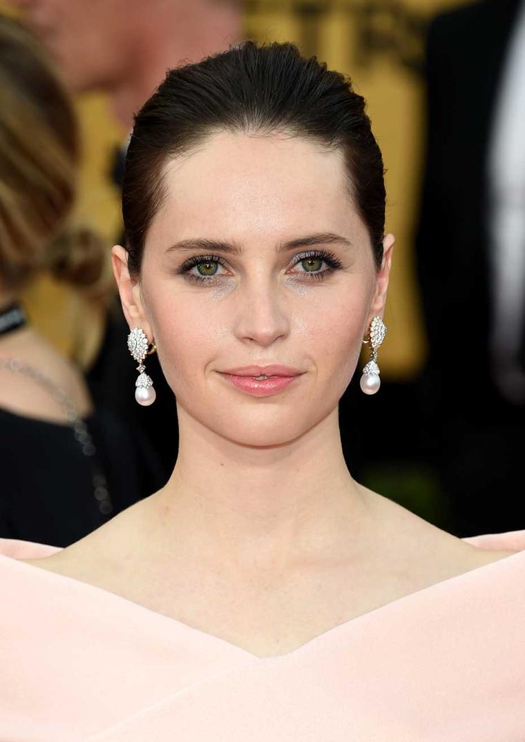 British nominee Felicity Jones sparkled in Van Cleef & Arpels jewelry on the 2015 SAG Awards red carpet. (Ethan Miller/Getty Images)