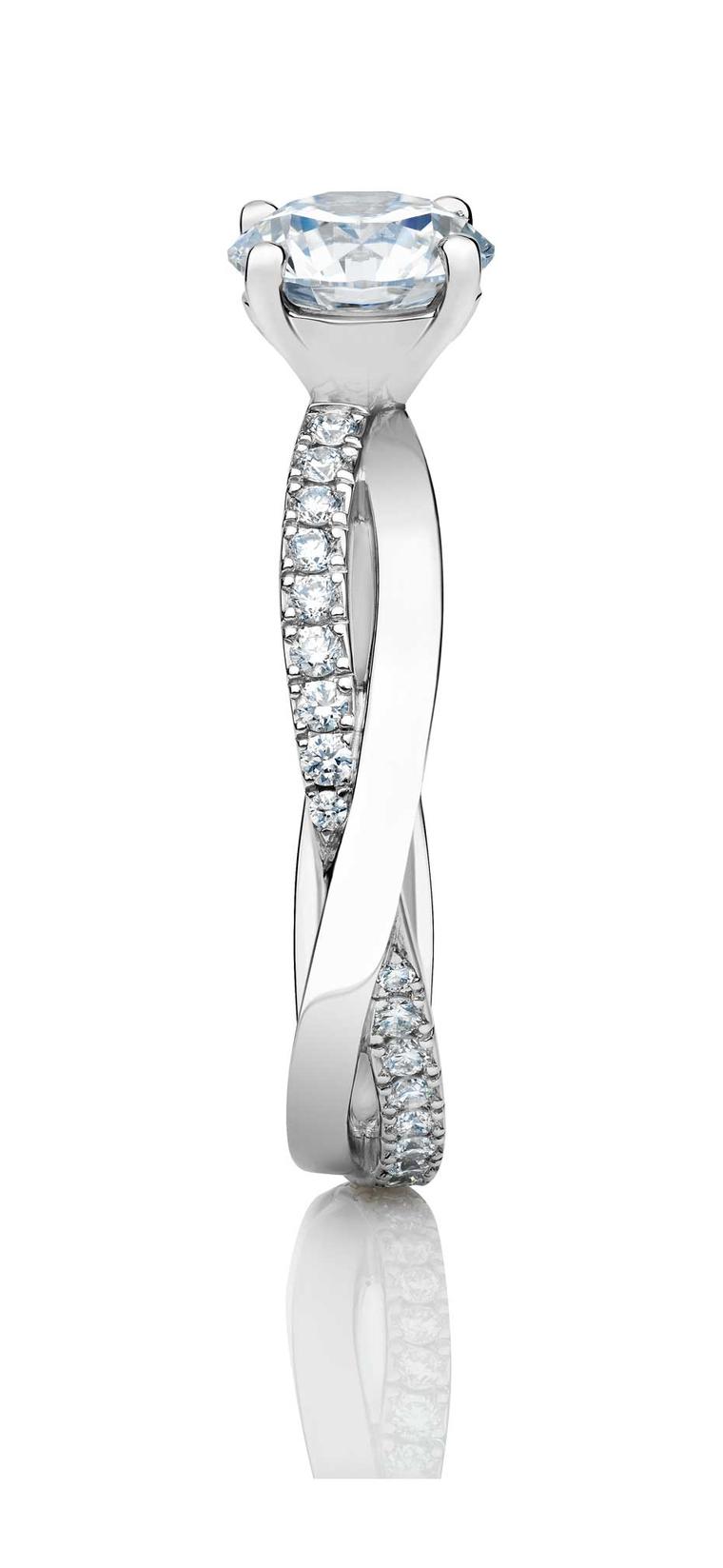 The new De Beers Infinity round diamond engagement ring is topped with a round brilliant-cut solitaire diamond.