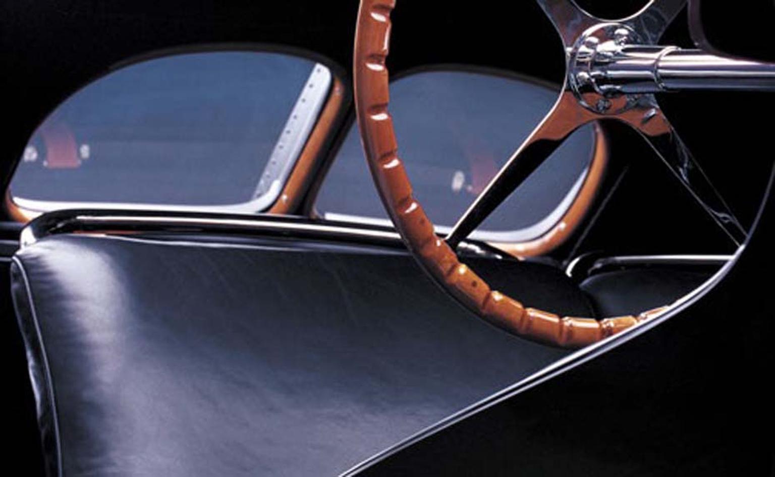 Interior of Ralph Lauren's black Bugatti Type 57SC Atlantic Coupe, a major source of inspiration for the Automotive Collection, incorporating details such as the wood dashboard and the six screws used on the hub to hold the Bugatti steering wheel to the c