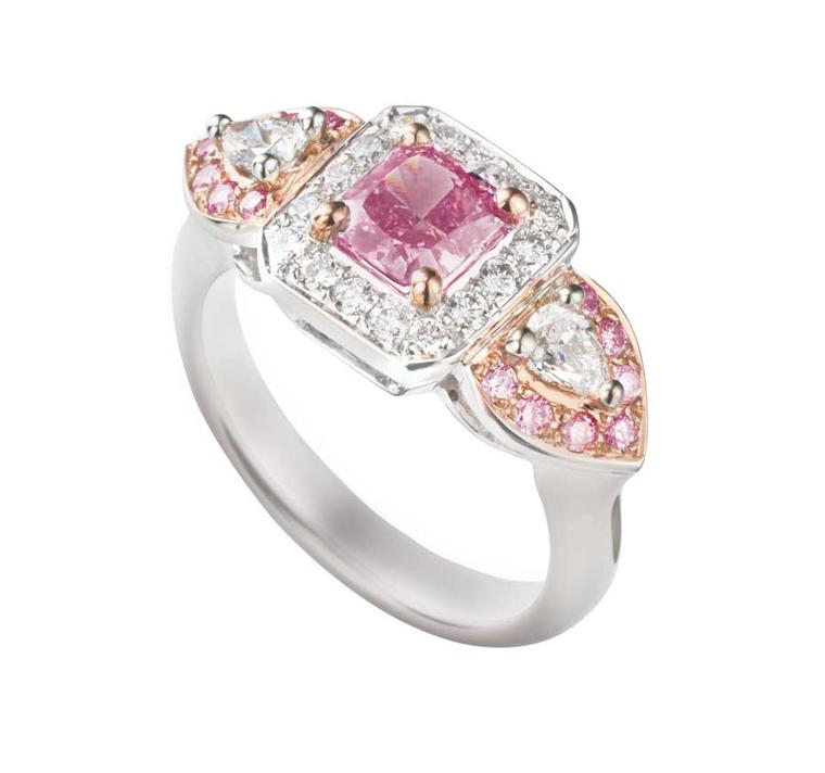 James Thredgold Pink Prosperity ring, featuring an 0.85ct radiant-cut Intense Pink Argyle diamond set within a white diamond halo. The hero gem is nestled within two pear-shape diamonds surrounded by a halo of pink Argyle diamonds in white gold. Available
