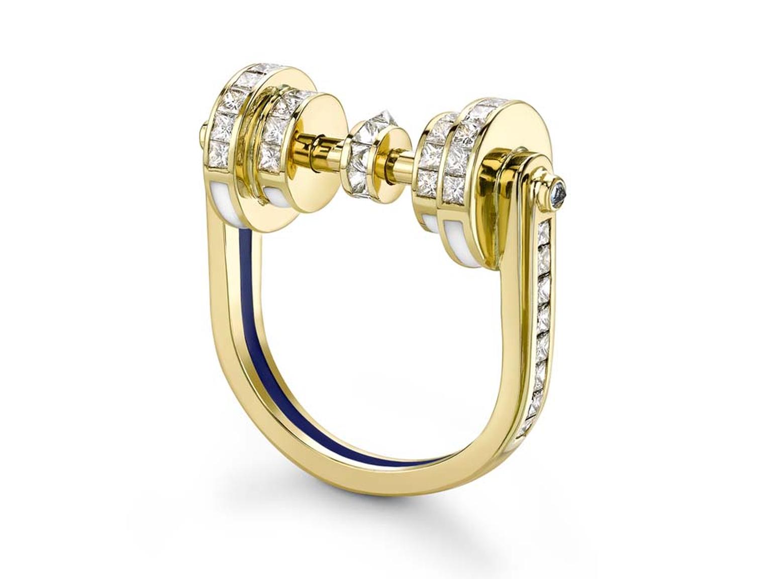 Emma Franklin diamond engagement ring in yellow gold with channel-set diamonds on all surfaces, blue sapphires, and enamel lines in blue and white.