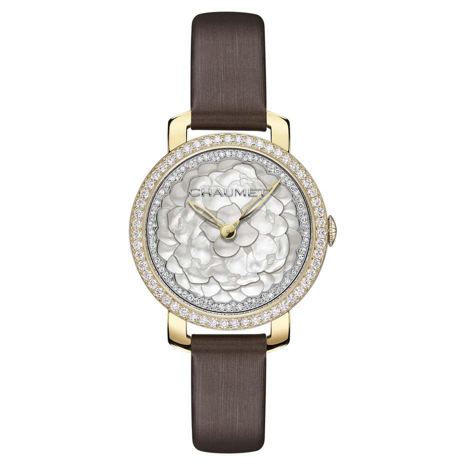 Chaumet Hortensia ladies' watch featuring a mother-of-pearl marquetry dial is presented in a 31mm yellow gold case and a brown satin strap.