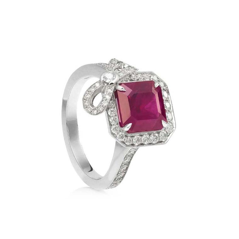 Boodles jewellery Vintage Rosette cushion-cut ruby engagement ring in platinum surrounded by melée diamonds and a pretty diamond bow.