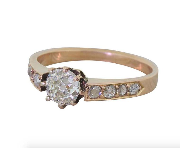 This Victorian engagement ring in rose gold is set with four rose-cut diamonds on either side of the central solitaire. Available at 1stdibs.com.