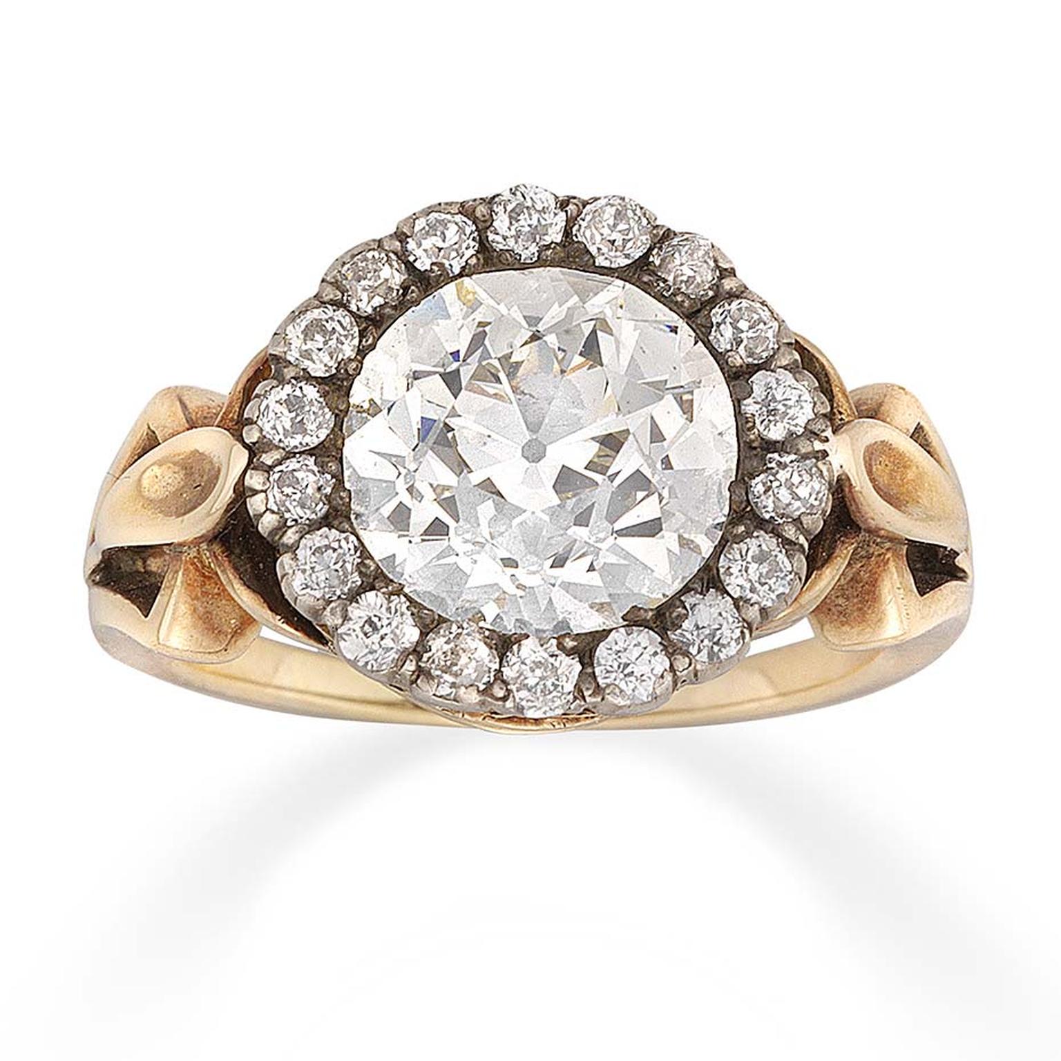 Bentley & Skinner diamond cluster Victorian engagement ring, dating from circa 1890, set with a large old-cut diamond in the centre of a gold mount, framed by old brilliant-cut diamonds.