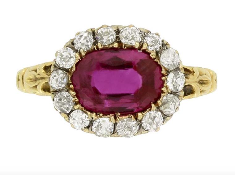 This early Victorian engagement ring, available from Berganza in London, features an oval, old-cut, natural, unenhanced Burmese ruby, encircled by a row of cushion-shape, old-cut diamonds. It dates from around 1850.