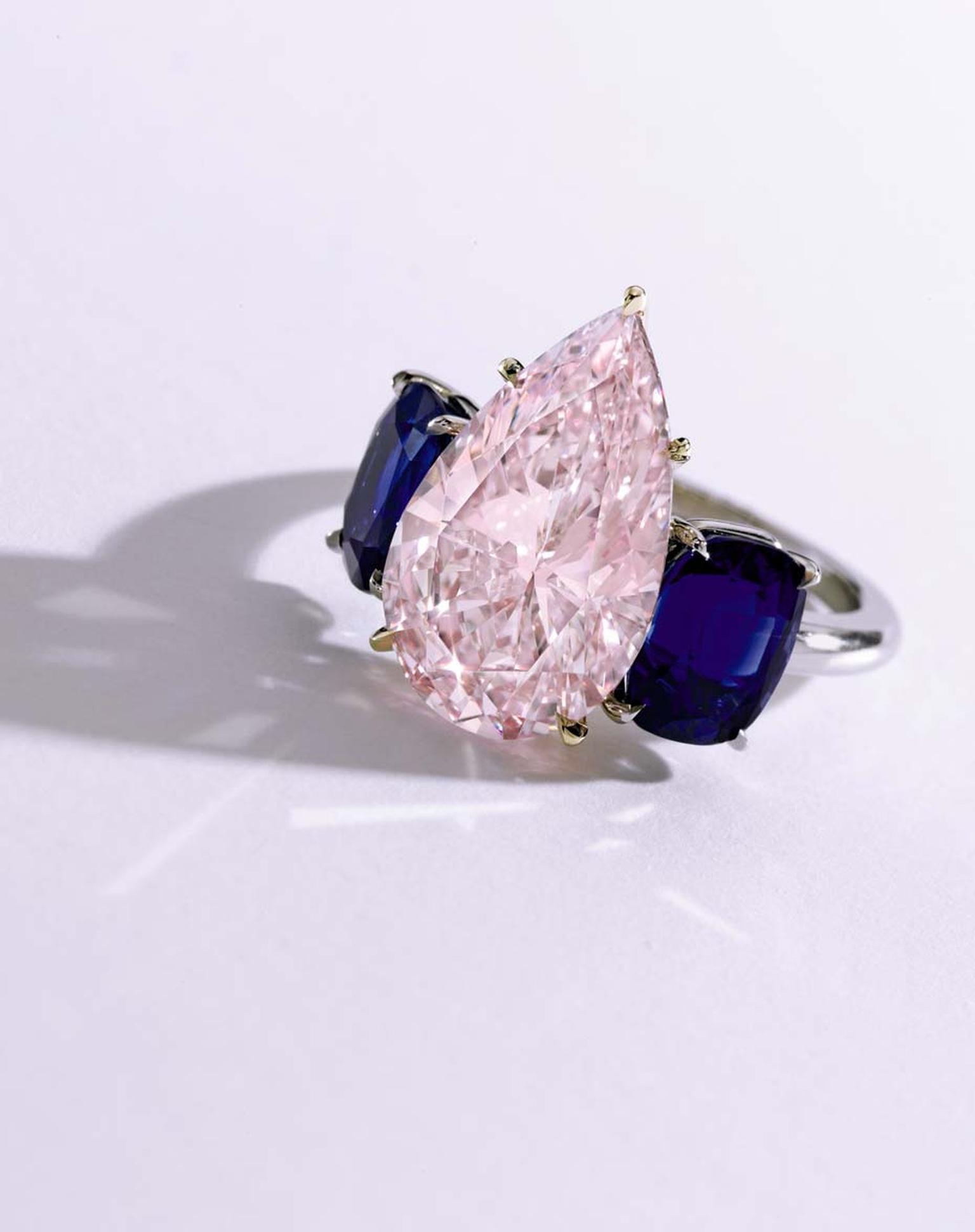 Pink diamond and sapphire ring set with an unmodified pear-shaped Fancy purplish pink 6.24ct diamond and two cushion-cut Kashmir sapphires in gold and platinum. It sold for $2.4 million at Sotheby's Auction of Magnificent Jewels on 21 April.