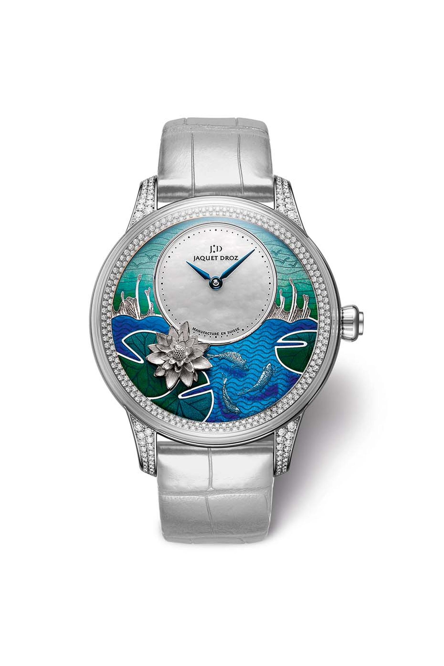 The Jaquet Droz Petite Heure Minute Carps watch paints a lovely Asian-inspired scene of Koi carp frolicking in the water with a lotus flower and bulrushes in the background. The skills of the artisans behind the exquisite enamelling and engraving work bri