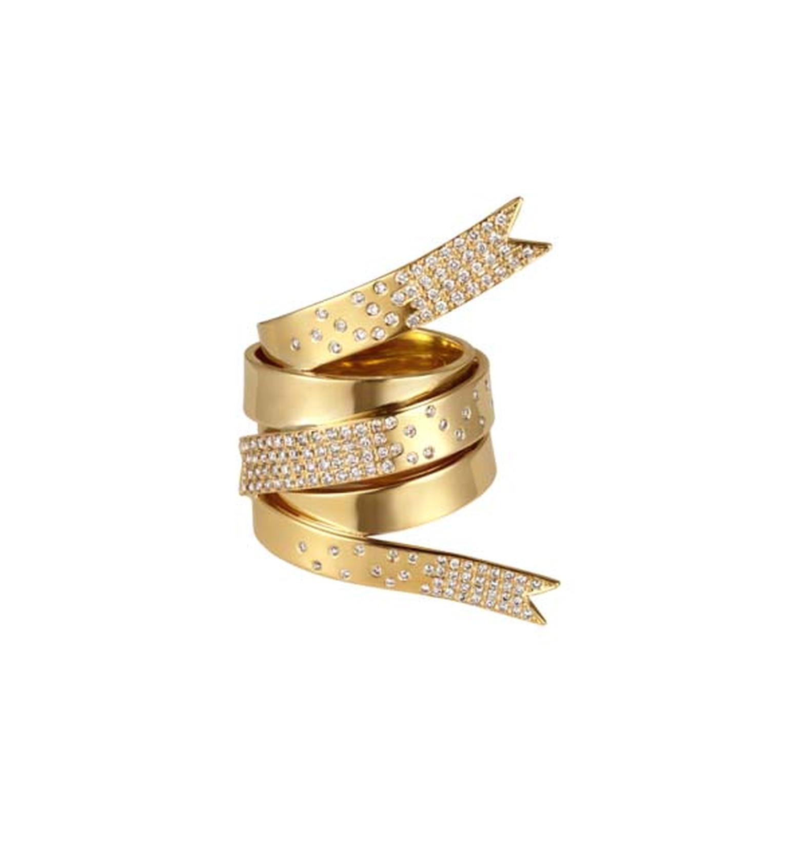 Yellow gold ring featuring a one-of-a-kind ribbon design with white diamonds by Greek designer Elena Votsi, who redesigned the Olympic medal in 2004.