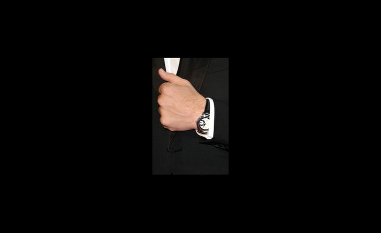 Javier Bardem wears a Chopard L.U.C. Regulateur watch to the Oscars 2011