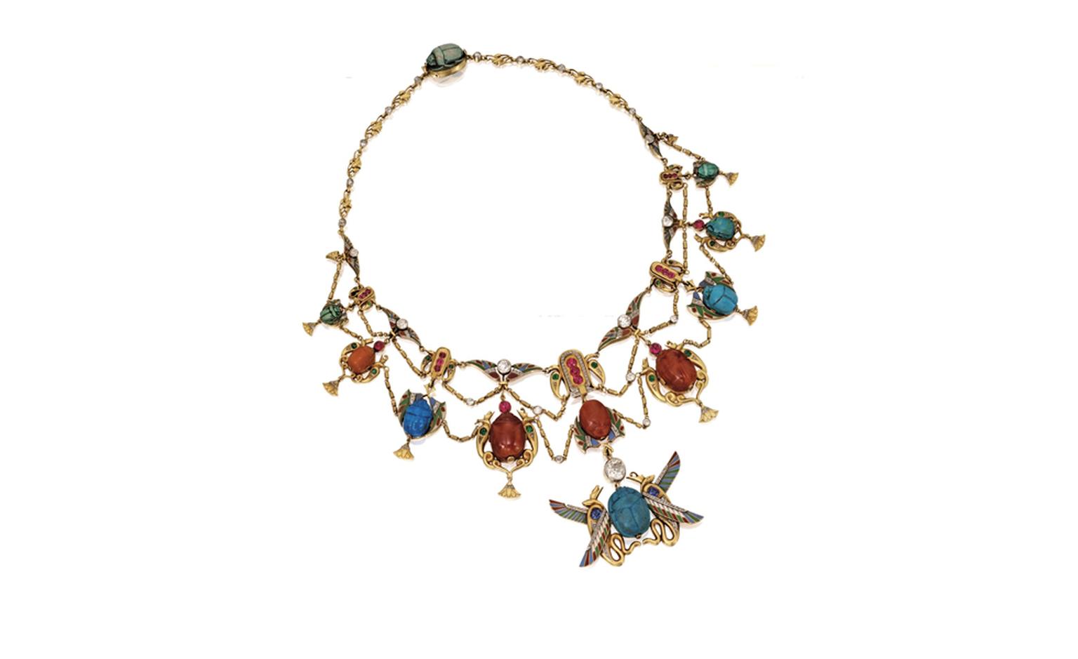 Lot 66 Gold, Platinum and Gem-Set Egyptian Revival Necklace and Pair of Bracelets, Early 20th Century Est. $40/60,000. SOLD FOR $50,000