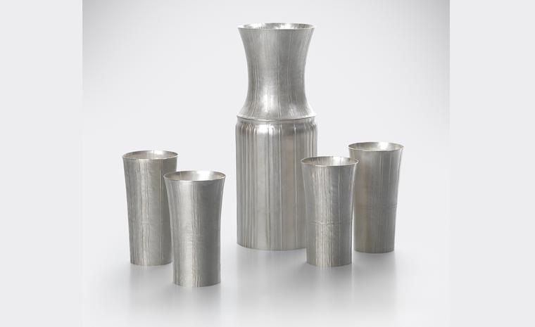 “Carafe and four Cups". by Grant McCaig 2010 Pleated Fine Silver, seamed and hand raised.