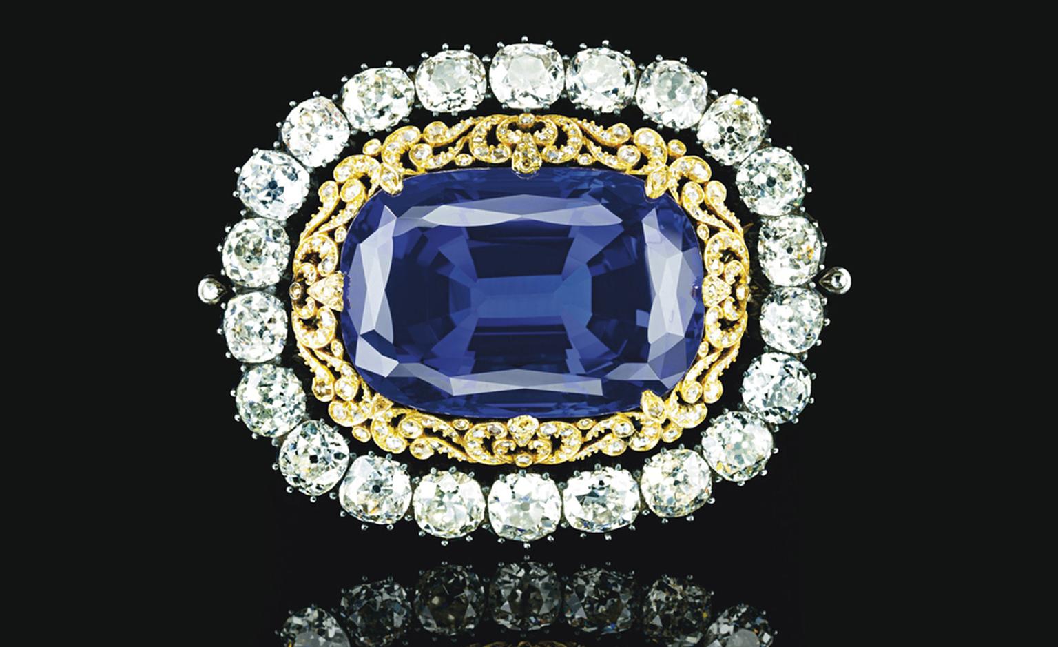 LLot 321. An Impressive sapphire and diamond brooch. Set with a cushion-cut sapphire, weighing 130.50 carats, to the openwork rose-cut diamond surround and collet-set old-cut diamond frame, mounted in silver and gold. Estimate CHF800, 000-CHF1,2...