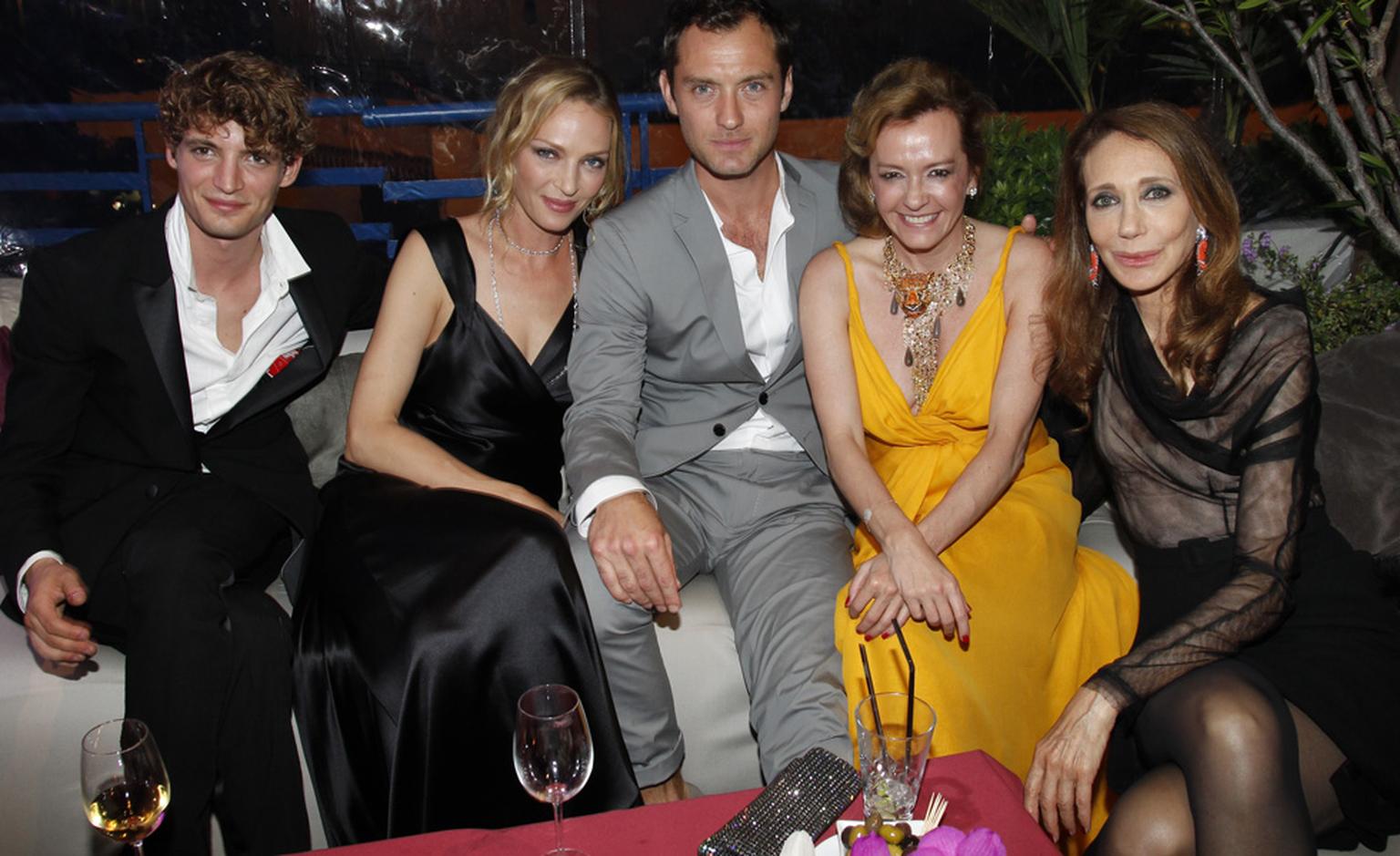 After the Trophée Chopard awards ceremony, the guests relax. From left to right, Trophée winnner Niels Schneider for his role in Heartbeats, Uma Thurman, Jude Law, Co-President of Chopard Caroline Gruosi-Scheufele and Marisa Berenson